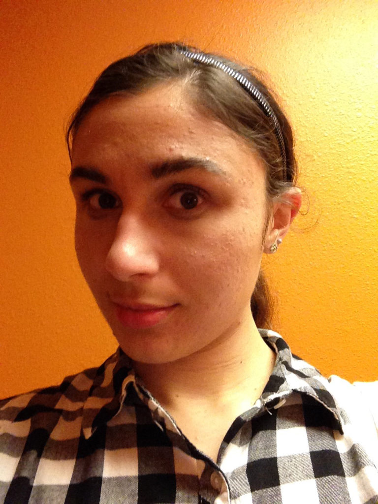 Ashlee Craft wearing a black & white plaid shirt & sparkly headband