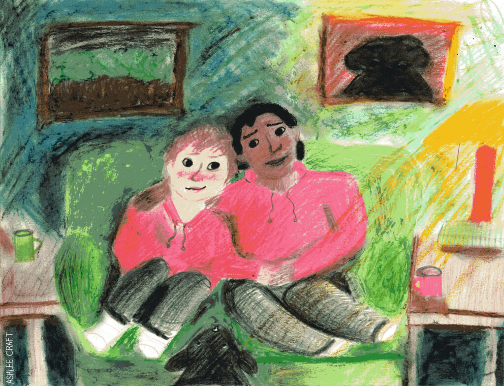 [IMAGE ID: A soft, slightly hazy pastel & colored pencil drawing of Jared & Darius sitting in the center of a green couch together. Darius is on the right & Jared is on the left. Their heads are touching & they are looking towards each other. Darius has his arm around Jared's shoulders & they are holding hands. Jared's other hand is resting in his own lap, & both Darius & Jared's legs are pulled up on the couch. Jared is shown as a Black person with medium-short curly hair, & Jared is shown as a white person with slightly shaggy brown hair. Both characters are wearing red hoodies, black pants, & white socks. Both are also blushing. Grove, the Hellhound which resembles something like a black lab, is standing in front of the couch with his head resting on the couch between Jared & Darius. The green couch is in front of a dark green wall with a painting of trees & a painting of Grove. On the right, there is a yellow lamp shedding light into the room. It sits on top of a wooden end table where a red mug also sits. On the right, there is another end table with a green mug on it. END ID]